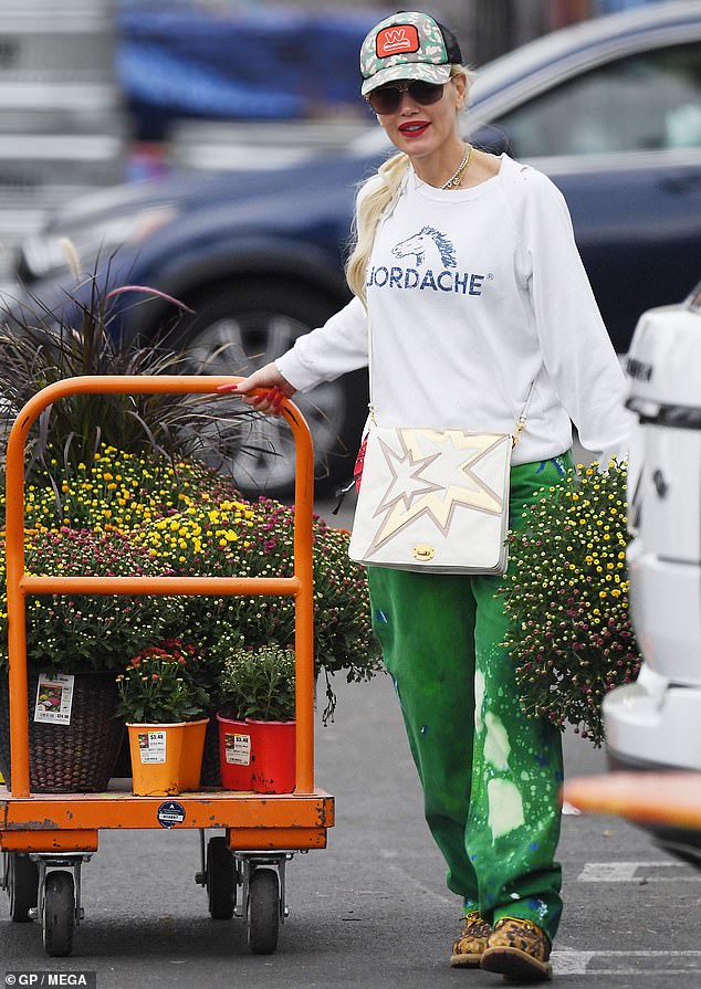 Stepping out: Gwen Stefani, 53, cut a youthful figure in a sweater and edgy green trousers as she visited a garden centre in Los Angeles on Saturday