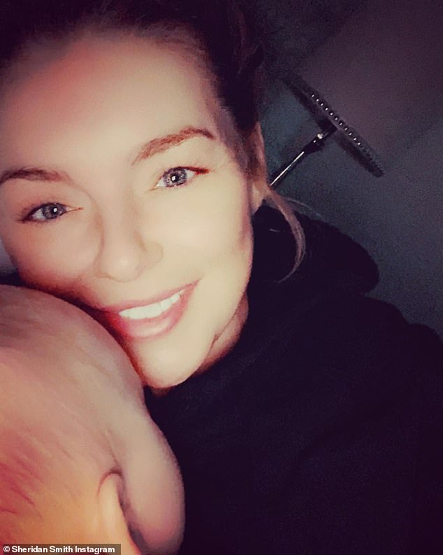 Cosy: Sheridan Smith has showed off the the new additions to her home this festive season as she gave a glimpse of the inside of her newly-decorated living room (pictured with son Billy)