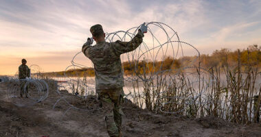 Abbott Vows to Keep Building Border Barrier if Biden Federalizes Texas National Guard in 'Bone-Headed Move'