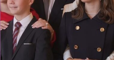 Pictured: Queen Mary, 51, pictured clinging onto her daughter Princess Josephine, 16, who looked smart in a black coat and pearls