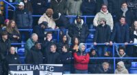 Chelsea fans left confused as group of men are spotted brushing their teeth in the stands during clash with Fulham at Stamford Bridge