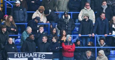 Chelsea fans left confused as group of men are spotted brushing their teeth in the stands during clash with Fulham at Stamford Bridge