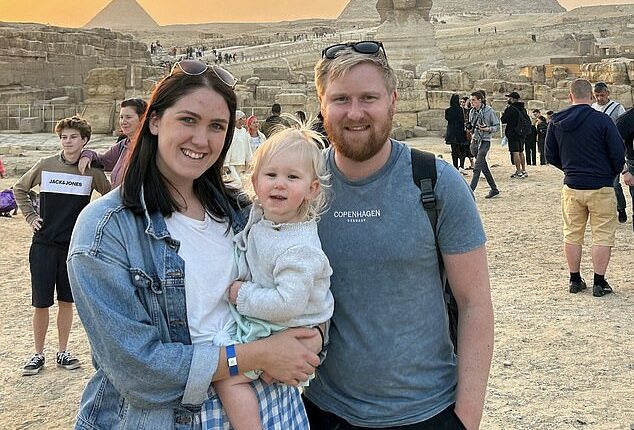 Savvy couple Alex and Scott Stroud have revealed the secret to their exciting globetrotting lifestyle (Both pictured with daughter Adelaide, two in Egypt)