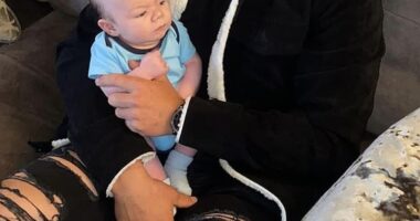 Father-of-two Matthew Syron had been enjoying drinks with friends Revolucion de Cuba in Leeds, West Yorkshire, when the glass was smashed into his eyes. Pictured: Mr Syron with his son Brixon shortly after he was born