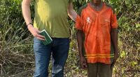 Ian Birrell with Justin Zoa, who told of being brutally whipped
