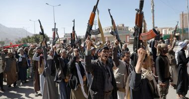 Huthi fighters brandish their weapons during a march in solidarity with the Palestinian people in the Huthi-controlled capital Sanaa on January 11