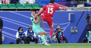 This is the moment Khalil Khamis kicks China 's Dai Wai Tsun in the face with his studs