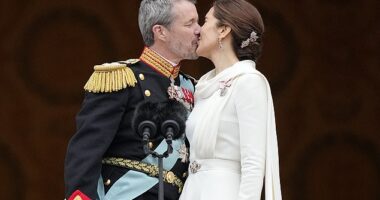 Long live the Queen! Mary of Denmark is elegant in an all-white ensemble as she shares a kiss with her husband on the balcony of Christiansborg Castle