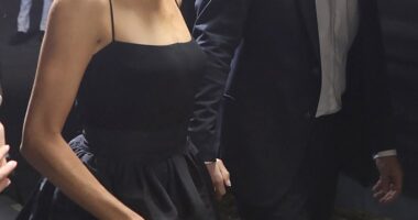 The Duchess of Sussex , 42, oozed glamour in the monochrome ensemble, which she looked to team with a simple body suit, on Tuesday evening