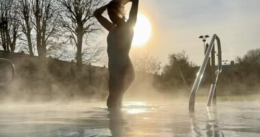 Mollie King showcased her sensational figure in a white swimsuit as she posed for an Instagram snap while enjoying a 'sunrise swim' on Monday