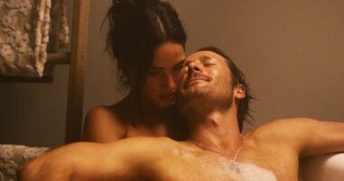 Adria Arjona and Glen Powell in Hit Man