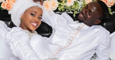 Sadio Mane and his teenage wife (pictured together) are not going on honeymoon because she has been made to return to school in preparation for her final exams, MailOnline can reveal, after footage posted online showed her being greeted by classmates