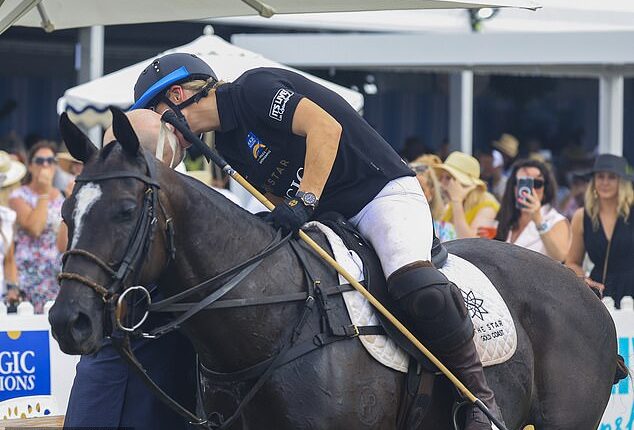 Zara Tindall and her husband looked loved up as ever as they shared a kiss at the Pacific Fair Magic Millions Polo & Showjumping event today