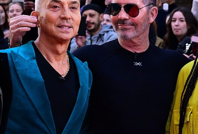 Simon Cowell poked fun at fellow judge Bruno Tonioli by tugging on his ear during the Britain's Got Talent photocall at London Palladium on Thursday afternoon