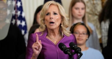 Who Wants to Tell Her?! LOL! Jill Biden Standing Behind THIS Sign of ALL Signs is Too Damn Funny (Pic)