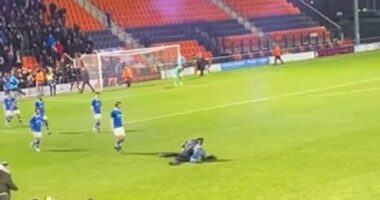 A National League match descended into chaos on Saturday when a pitch invader punched a steward