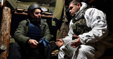 First line of defence: Richard Pendlebury, left, with Sasha, a gunner tasked with stopping Russian assaults reaching Ukraine trenches