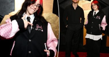Billie Eilish reps 'Barbie' in pink varsity jacket on the Grammys 2024 red carpet