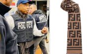New York City 's Mayor Eric Adams wore a $700 Fendi scarf underneath a bulletproof police vest during a press briefing about migrant crime in the city. Adams , who is no stranger to lavish tailor-made suits and designer labels on his $258,000 salary, wore the flashy designer item on Monday morning. The beige wool and silk scarf, fit with Fendi's iconic monogram, retails for a cool $690 from the designer's website.