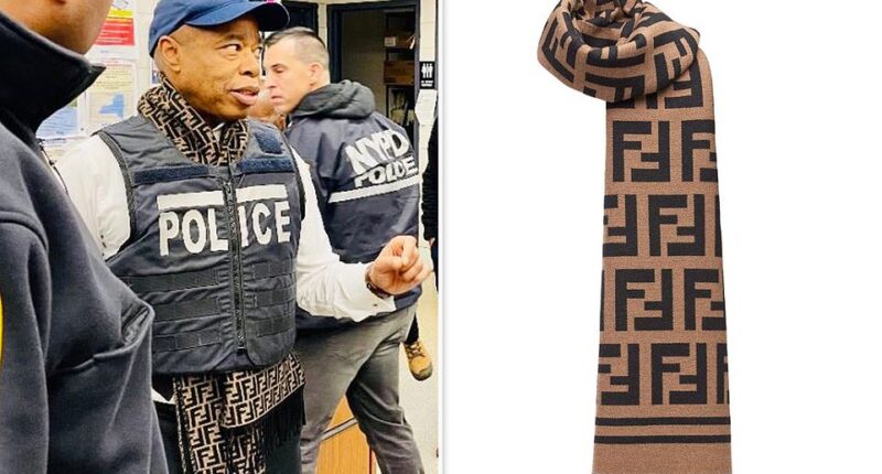 New York City 's Mayor Eric Adams wore a $700 Fendi scarf underneath a bulletproof police vest during a press briefing about migrant crime in the city. Adams , who is no stranger to lavish tailor-made suits and designer labels on his $258,000 salary, wore the flashy designer item on Monday morning. The beige wool and silk scarf, fit with Fendi's iconic monogram, retails for a cool $690 from the designer's website.