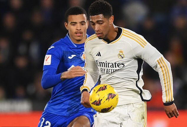 Jude Bellingham (white) and Mason Greenwood (blue) faced off in the derby clash on Thursday night