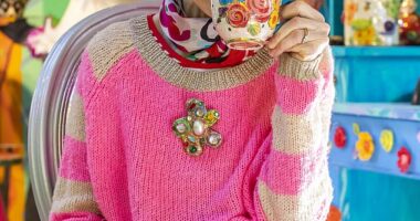 Pictured: Artist Mary Rose Young sipping a cup of tea in her at-home pottery studio, which features a multicoloured ceiling