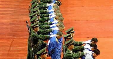 Criminal law in the country is as severe as it is obfuscated, with many crimes punishable by death under Beijing 's draconian legislation. Pictured: Police parade a group of convicts at a sentencing rally in Wenzhou, 2004. People are often handed death sentences at such rally