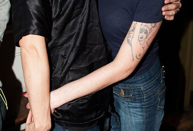 Isabelle Thomas, who killed herself on Monday, is pictured with Amy Winehouse at a party in London in 2010. Winehouse died of an accidental overdose in July 2011 aged 27