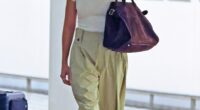 Margot Robbie (pictured) looked very casual as she touched down in Brisbane, Australia after travelling to her home state by herself