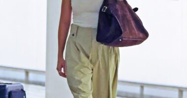 Margot Robbie (pictured) looked very casual as she touched down in Brisbane, Australia after travelling to her home state by herself