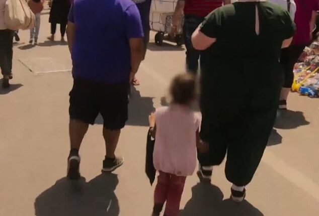 Pictured left to right at Crawford Market: Phil, an unknown girl begging for food and Tiffany on Around The World in 80 Weighs