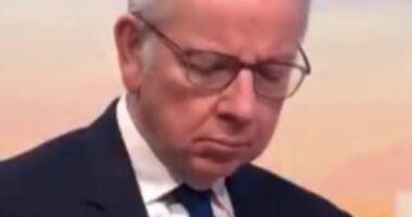 Michael Gove was caught looking at his phone this morning before he was introduced on the BBC 's Sunday with Laura Kuenssberg