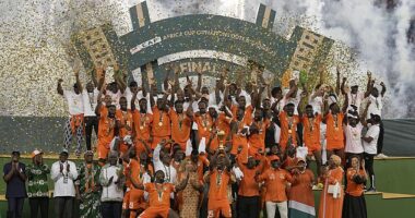 Ivory Coast lift the African Cup of Nations trophy after narrowly beating Nigeria 2-1