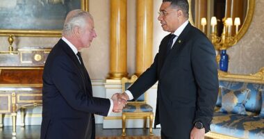 King Charles III shakes hands with Prime Minister of Jamaica, Andrew Holness, in September 2022