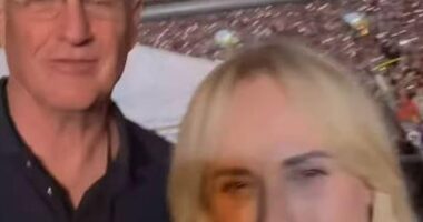 Rebel Wilson had a prime seat to watch Taylor Swift as the pop star took the stage in Sydney for her second show at Accor stadium on Saturday night. The Australian actress even got a selfie with Taylor's father, Scott Swift, affectionately known to fans as 'Papa Swift'. Pictured