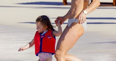 Pictured: Pippa Middleton seen dashing towards the water with her eldest daughter Grace earlier this month