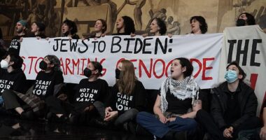 Protesters took over the lobby of 30 Rock on Monday as President Joe Biden was taping an episode of Late Night with Seth Meyers upstairs