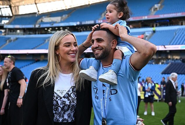 Former Manchester City winger Riyad Mahrez celebrates with his wife Taylor Ward and their young daughter Mila