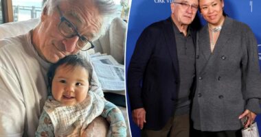 Robert De Niro, 80, snuggles daughter Gia, 10 months, in rare photo