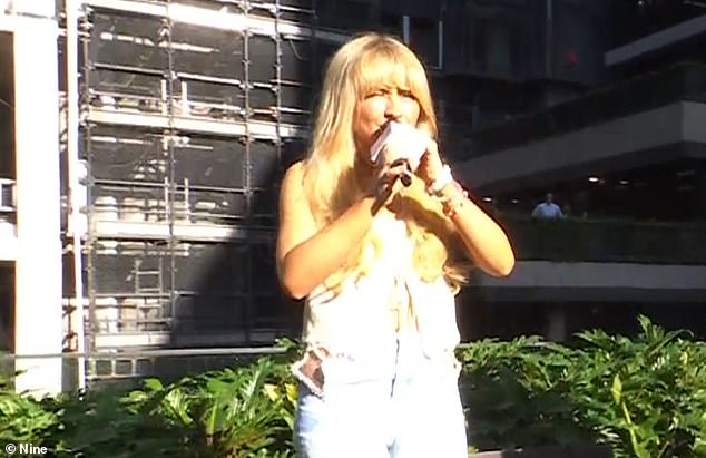 Sabrina Carpenter was left struggling to see her excited fans as she was forced to do an interview in the glaring sunshine on Monday morning