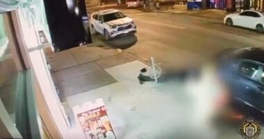 Shocking video shows migrant moped riders dragging woman along NYC street as they steal her phone as cops reveal Venezuelan gang is behind 62 thefts