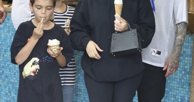 Kourtney Kardashian, 44, (second right) was spotted visiting hot spot Gelato Messina at Bondi Beach with her children Reign, nine, (left) and Penelope, 11, (second left) on Saturday