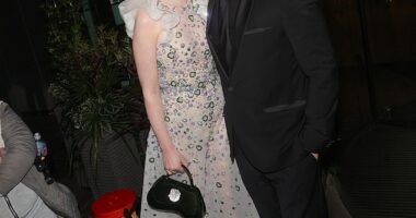 Katherine Ryan, 40, appeared to be feeling amorous after the TV Choice Awards as she planted a kiss on husband Bobby Kootstra