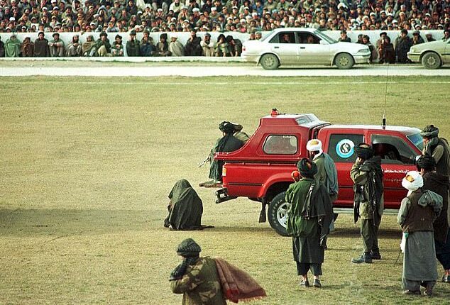 Taliban execute two murderers by machine-gunning them in front of thousands of spectators at football�stadium