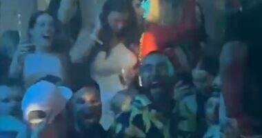 Travis Kelce has been pictured downing champagne and partying in a Las Vegas club