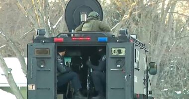 Dozens of heavily armed officers descended on the street in Burnsville after the shooting in the early hours of Sunday morning