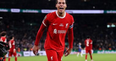 Virgil van Dijk hails his Liverpool teammates after they defeated Chelsea to win the Carabao Cup at Wembley... with the Dutchman netting the winning goal in extra-time