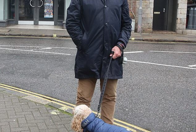 Jeremy Bettis, 67, who is walking Archie - wearing a Hugo&Hudson doggie-warmer - believes opening a Wetherspoons in Marlow will attract a different type of visitor to the historic town