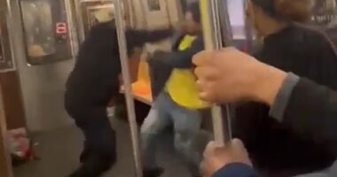A harrowing video reveals the moments leading up to the New York City subway shooting, as the agitator accuses the other man of a 'migrant beating up cops' in a heated argument