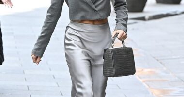 Amanda Holden flashed her toned abs in a plunging crop top while leaving Heart Studios on Thursday